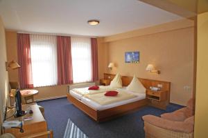 Postel nebo postele na pokoji v ubytování Hotel Vier Linden