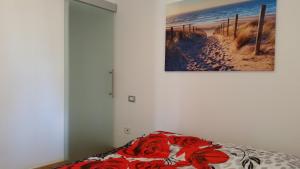 Posteľ alebo postele v izbe v ubytovaní Appartamento l'Aurora