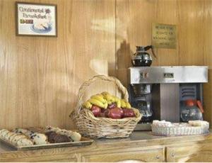 a basket of fruit on a counter in a coffee shop at America's Best Value Inn of Novato in Novato