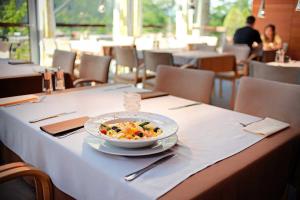 a bowl of food on a table in a restaurant at Clanwilliam Hotel in Clanwilliam