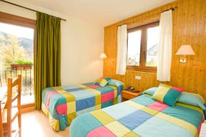 Postel nebo postele na pokoji v ubytování Hotel Llibrada