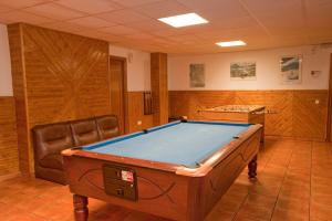 a room with a pool table in a room at Hotel Llibrada in Benasque
