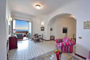 a living room with a couch and a table at Hotel Belvedere in Conca dei Marini