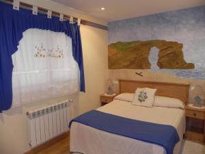 Cama ou camas em um quarto em O Lar de Carmiña