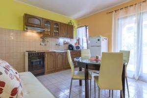 Kuchyň nebo kuchyňský kout v ubytování Apartments Monte Grande