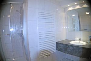 Koupelna v ubytování Hotel Vier Linden