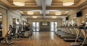 a gym with a row of treadmills and ellipticals at Four Seasons Resort and Residences Anguilla in Meads Bay