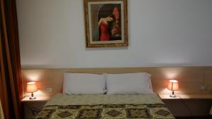 A bed or beds in a room at Villa Betta