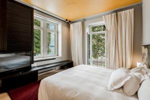 Llit o llits en una habitació de Hotel Bella Riva