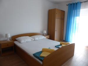 Postel nebo postele na pokoji v ubytování Apartments Adria