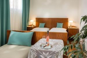 Postel nebo postele na pokoji v ubytování Vinařství & Vinařský dům Petratur