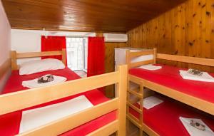a room with two bunk beds in a cabin at The City Place Hostel in Dubrovnik