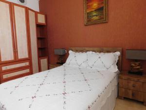Llit o llits en una habitació de Avrora Luxury Apartment