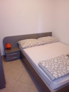 Postel nebo postele na pokoji v ubytování Apartments Jurjevic