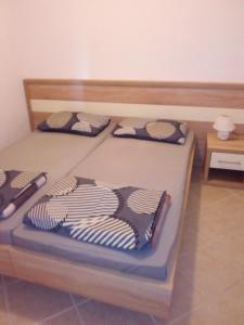 Postel nebo postele na pokoji v ubytování Apartments Jurjevic