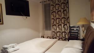 Postel nebo postele na pokoji v ubytování Hotel Livia