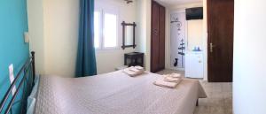 Postel nebo postele na pokoji v ubytování Sokaki rooms + 36 fotografií