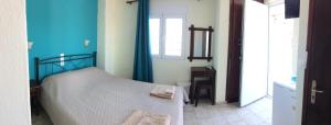 Postel nebo postele na pokoji v ubytování Sokaki rooms
