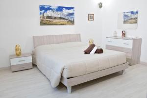 Postel nebo postele na pokoji v ubytování Domus Relax + 37 fotografií