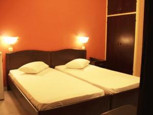 Postel nebo postele na pokoji v ubytování Hotel Figalia