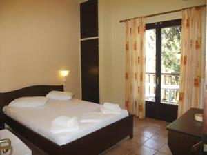 Postel nebo postele na pokoji v ubytování Hotel Figalia