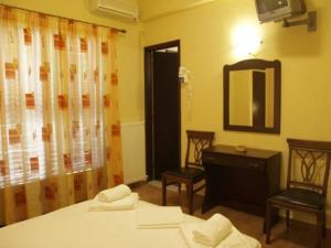 Postel nebo postele na pokoji v ubytování Hotel Figalia