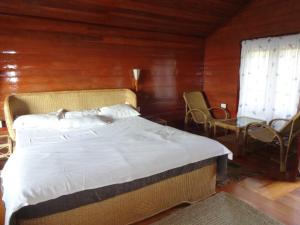 Postel nebo postele na pokoji v ubytování Surya Holidays Kodaikanal