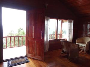 Posezení v ubytování Surya Holidays Kodaikanal