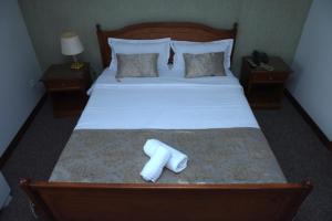 Voodi või voodid majutusasutuse Hotel Skala toas