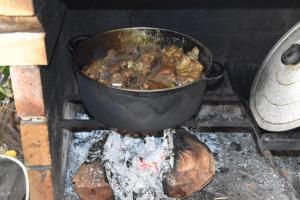 a pot of food is cooking over a fire at Fleur des iles in Bras-Panon