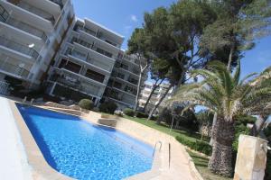 a swimming pool in front of a apartment building at For a Stay Sant Jordi in Salou
