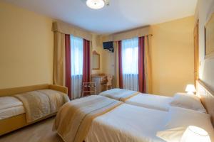 Postel nebo postele na pokoji v ubytování Garni Bellavista