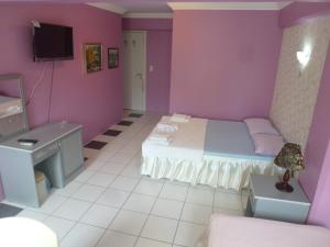 Ein Bett oder Betten in einem Zimmer der Unterkunft Hotel Europa