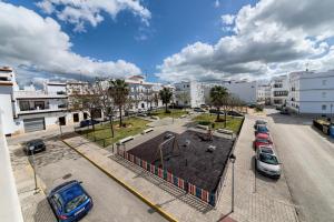 an aerial view of a parking lot in a city at Apartamentos Villas Flamenco Rentals in Conil de la Frontera