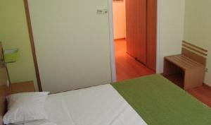 Cama ou camas em um quarto em Viseu Garden Hotel