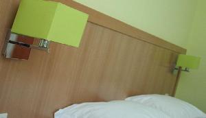 Cama ou camas em um quarto em Viseu Garden Hotel
