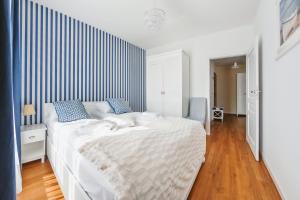 Posteľ alebo postele v izbe v ubytovaní Apartamenty Sun & Snow Gdańsk Bursztynowa