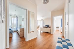 Televízia a/alebo spoločenská miestnosť v ubytovaní Apartamenty Sun & Snow Gdańsk Bursztynowa