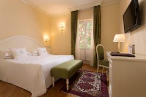 Кровать или кровати в номере Hotel Cenobio Dei Dogi