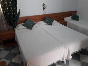 Posteľ alebo postele v izbe v ubytovaní Hostal Centro Sol