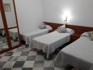 Posteľ alebo postele v izbe v ubytovaní Hostal Centro Sol
