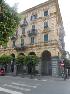 a large building on the side of a street at Colors of Cinque Terre - Guest House in La Spezia