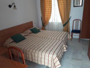 Posteľ alebo postele v izbe v ubytovaní Hostal Centro Sol
