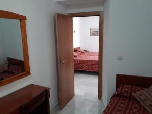 Posteľ alebo postele v izbe v ubytovaní Hostal Centro Sol