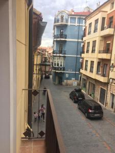 a view from a balcony of a street with cars at Apartamento Abadia Teruel in Teruel