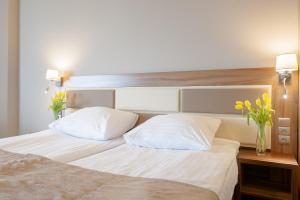 Postel nebo postele na pokoji v ubytování Hotel Diament Ustroń