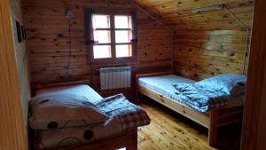 Posteľ alebo postele v izbe v ubytovaní Dom Wakacyjny u Chmiela