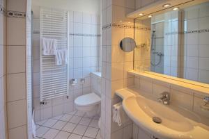 Koupelna v ubytování Hotel Westfalenhof + 31 fotografií