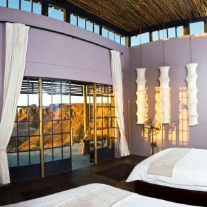 Ένα ή περισσότερα κρεβάτια σε δωμάτιο στο Fish River Lodge