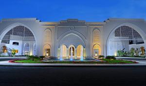 a large building with a fountain in front of it at Steigenberger Alcazar in Sharm El Sheikh